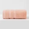 Soft coral pink rolled 100% cotton towel featuring thick terry weave texture - Standard Size / Coral Pink
