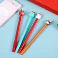 Detail of Christmas gel pens featuring Santa, Reindeer, and Tree silicone toppers - Style E Christmas Character Gel Pen (4903330637488)