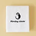 Soft white cotton towel featuring a minimalist black monkey embroidery and Monkey clever text - Monkey(Monkey clever) / Face Towel (75x35cm) / White