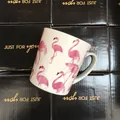 Top view of white ceramic flamingo mug placed on gift boxes with Just For You text - Watercolor Flamingo