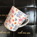 Detailed close-up of flamingo ceramic mug with pink floral pattern and black gift box - Floral Flamingo