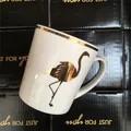 Pink flamingo ceramic mug with golden rim and handle on premium black gift box set - Gilded Flamingo