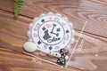 Pastel pink Alice in Wonderland PVC coaster with clock design and white bow detail - Alice