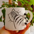White ceramic cat mug with black line drawing and a 3D curled tail handle - Ceramic / Cat Style (CK227)