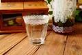 Retro glass cup featuring white lace patterns and vertical stripes for summer drinks - Lace Rim Cup