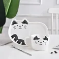 Ceramic coffee cup and saucer set featuring a cute black and white cat pattern design - Cup Saucer And Spoon / Black Spotted Cat