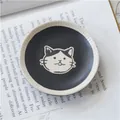 Japanese style stoneware sauce dish with hand-painted black and white cartoon cat face - Black