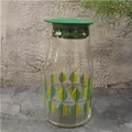 Glass pitcher with green lid and leaf pattern for cold water and herbal iced tea - Leaf