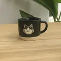 Japanese style matte black ceramic mug with minimalist cat design and cream ribbed base - Black Glazed Mug