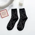 Cute black mid-calf socks with white repeating cat patterns and knit cotton texture - Black