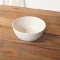 Japanese style ceramic bowl with embossed cherry blossom patterns in cream white finish - White Sakura Rice Bowl