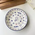 Ceramic round plate featuring blue hand-painted sushi cat and onigiri illustration - Blue Deep Plate