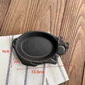 Matte black pig-shaped ceramic plate with dimensions 13.8cm by 9cm on a wooden table - Matte Black / Black