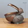 Estatua de pelícano en bronce vintage para guardar llaves y decoración del hogar - Oro Antiguo