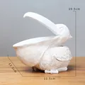Estatua de pelícano de resina blanca para guardar llaves - Blanco retro