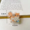 Cute ginger and white cartoon cat acrylic binder clip with dimensions 3.8cm by 4.2cm - Orange Cat Playing Ball