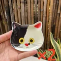 Set of two cute tuxedo cat ceramic sauce dishes in hand-held display - Cow Cat