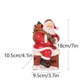 Santa Claus sitting on a chimney figurine with dimensions of 18cm height and 10.5cm width - Santa Sitting On Chimney (RRW121)