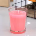 Scented pink wax candle in a clear glass jar with a minimalist cylindrical design - Pink Candle