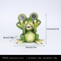 Solar powered green frog garden statue with LED glowing eyes, size 14x13.5cm - See No Evil