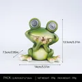 Solar powered frog garden ornament with large LED eyes and green resin texture - Speak No Evil