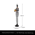 African woman figurine with golden jar and geometric pattern dress, 42cm height - African Woman Holding Pot - Hat - White