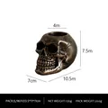 Bronze skull candle holder with realistic texture and dimensions of 10.5cm by 7.5cm - Gold