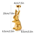 Golden bunny candle holder with leaf relief texture and product dimension markings - Standing Rabbit