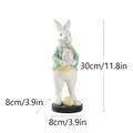Figura conejo de Pascua de resina con chaqueta de lunares verdes y huevo rosa 30cm - Estilo con Pelota