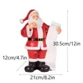 Statuina di Babbo Natale in resina con pergamena e dimensioni 30,5x21x12cm - Stile Scrittura Lista (RRW120)