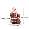 Resin Santa Claus figurine with gift sack and wreath, dimensions 16.5x12x7.5 cm - Santa Holding Wreath (RRW122)