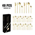 Détail d'un service de couverts 40 pièces en acier doré avec coffret cadeau élégant - Or