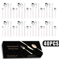 Macro view of 40-piece silver stainless steel cutlery set with elegant pink handles in a box - Pink Silver