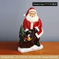 Statuetta di Babbo Natale in resina con sacco regalo e base innevata, 17x9x28cm - Stile Regali a Terra (RRW106-I)