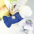 Detail of dark blue denim pet dress with ruffled hem and D-ring for leash attachment - XS / Dark Blue