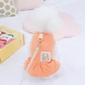 Detalle del vestido naranja para perro con bordado y anilla metálica para la correa - Rosa