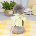 Detail view of yellow pet harness vest with ruffles and bunny embroidery on a small dog - S / Yellow