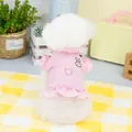 Detailed back view of a pink pet harness dress with rabbit embroidery and ruffles - S / Pink