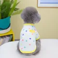 Detail of a white pet vest with colorful dots and 'AWESOME' patch on a small dog - S / White