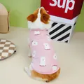 Close-up of pink fleece pet vest with white dog patterns on a Corgi model - S / Pink