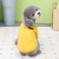 Bright yellow quilted dog vest with D-ring and leather patch on a toy poodle - Turmeric