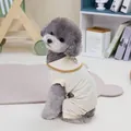 Detail of waffle fabric pet jumpsuit with bear embroidery on a gray poodle - S / Off-white