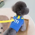 Blue dog harness vest with white letter M and yellow leash shown on a poodle back - S / Blue