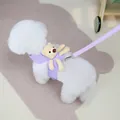 Detail of lavender pet harness set with plush bear toy and leash on a white dog - S / Purple