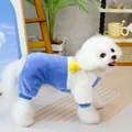 Detail of blue and white dog fleece jumpsuit with a 3D yellow duck and Goodluck charm - S / Blue