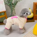Detail of pet fleece jumpsuit featuring a pink A patch and contrast piping - S / Beige