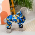 Detail of dog winter jumpsuit featuring blue camouflage pattern and warm hooded design - S / Blue