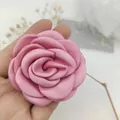Close-up of pink satin camellia flower for hair accessories and DIY apparel decor - Dusty Rose