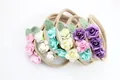 Detailed close-up of mini fabric roses and leaves on soft elastic baby nylon headbands - Mixed Colors Shipped Randomly