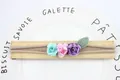 Elastic baby headband with colorful fabric mini roses and green knit leaf detail - Pink Purple Blue